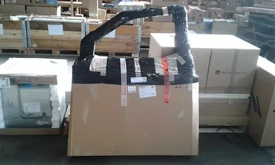 large cardboard package with irregular shape wrapped for transport